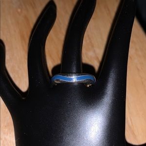Silver ring with blue going through middle